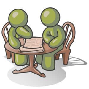 Clipart Illustration of Two Olive Green Businessmen Sitting at a Table, Discussing Papers